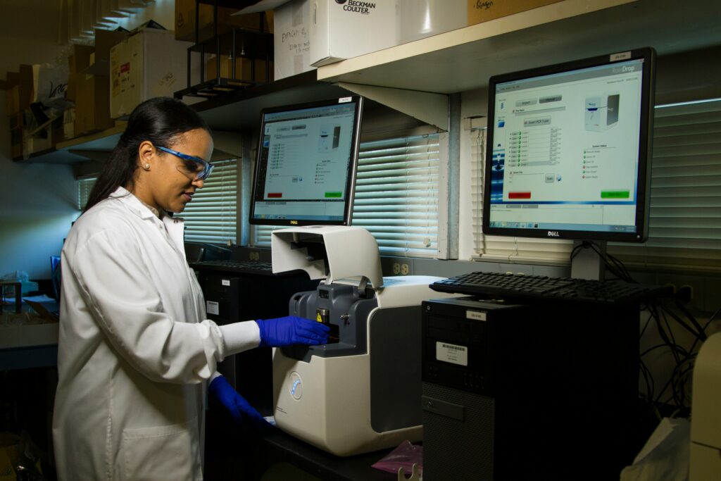 Doctor working in laboratory using machines