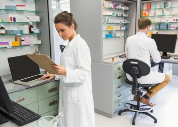 Two pharmacists in white lab coat working in a pharma company. Best PCD Pharma Opportunities in Manipur - By - Smotec Pharmaceuticals. 
https://smotecpharma.com/