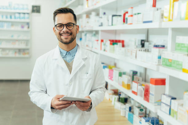 A pharmacists in white lab coat looking in front of the camera in a pharma shop, which has a shelves stocked with pharma products.

Best PCD Pharma Opportunities in Manipur - By Smotec Pharmaceuticals. https://smotecpharma.com/