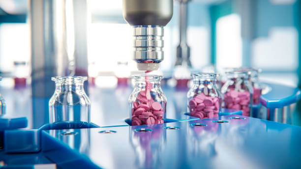 A manufacturing machine in the manufacturing unit is adding a red colour medicine in the medicine bottle. - By Smotec Pharmaceutiucals (Best PCD Pharma Company in Meghalaya ) https://smotecpharma.com/